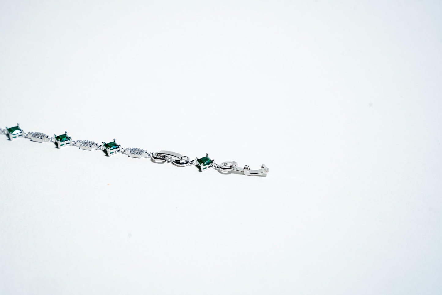 The Verdant Link: Emerald Eternity Bracelet in 925 Silver