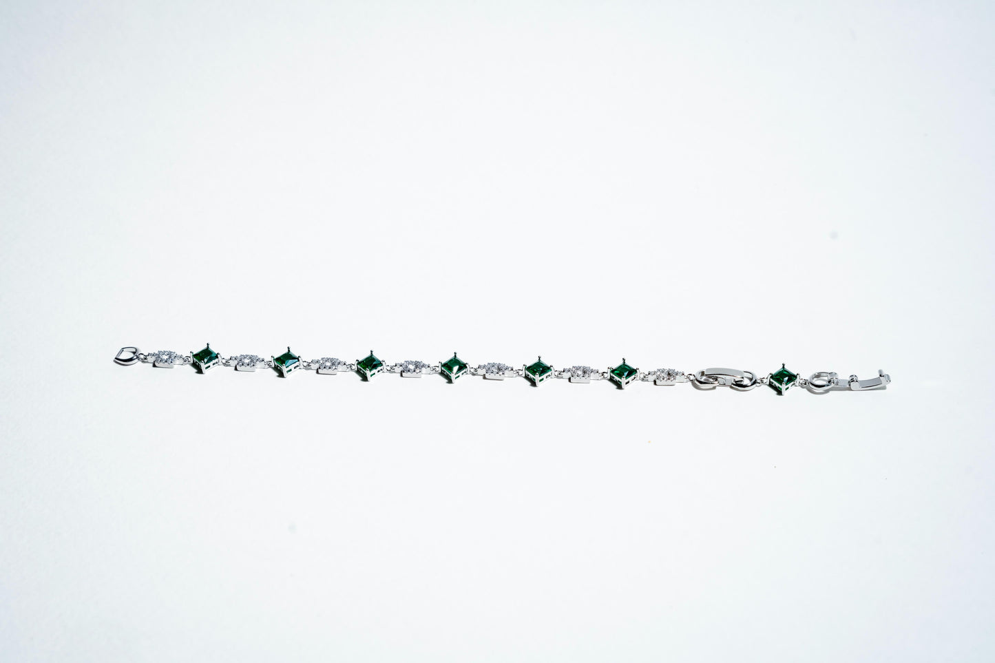 The Verdant Link: Emerald Eternity Bracelet in 925 Silver