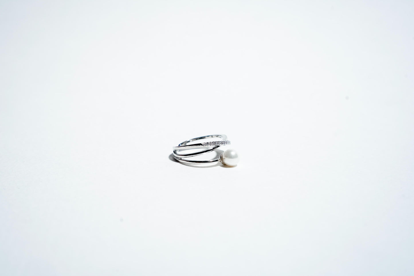 The "Ethereal Intertwine" Pearl & Pavé Crossover Ring