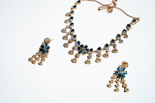Azure Blossom Radiance: 18k Gold-Plated Crystal Floral Necklace & Earring Set