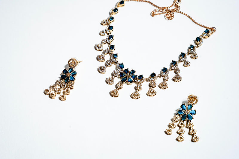 Azure Blossom Radiance: 18k Gold-Plated Crystal Floral Necklace & Earring Set